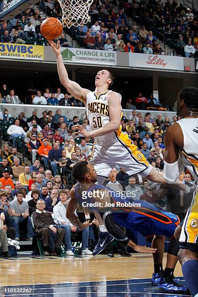 Tyler Hansbrough of the Indiana Pacers shoots over Jared Jeffries of the New York Knicks on March 15, 2011 at Conseco Fieldhouse in Indianapolis,...