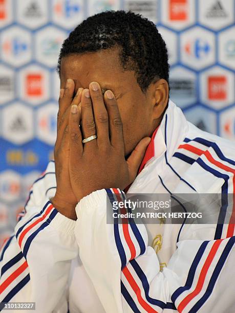 France's captain Patrice Evra reacts during a press conference in Knysna on June 19, 2010 during the 2010 World Cup football tournament in South...