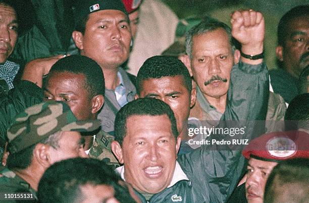 Venezuelan President Hugo Chavez returns to office two days after he was ousted from the Palace of Miraflores and arrested by the military in...