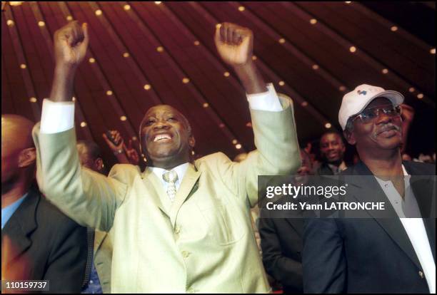 Laurent Bagboy, FPI candidate for presidential elections in meeting in Abidjan, Cote d'Ivoire on October 21, 2000 - Right: A - Sangare, FPI general...