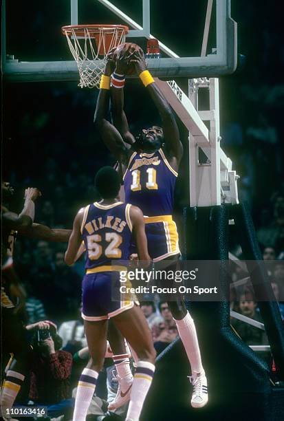 Bob McAdoo of the Los Angeles Lakers in action against the Washington Bullets during an NBA basketball game circa 1983 at the Capital Centre in...