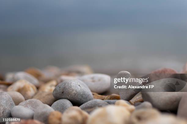heart shaped pebble on french riviera beach - pebble stock pictures, royalty-free photos & images