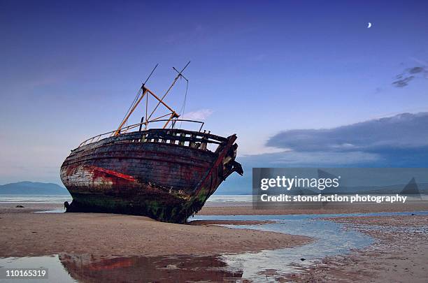 shipwreck under the crescent moon. - shipwreck stock pictures, royalty-free photos & images