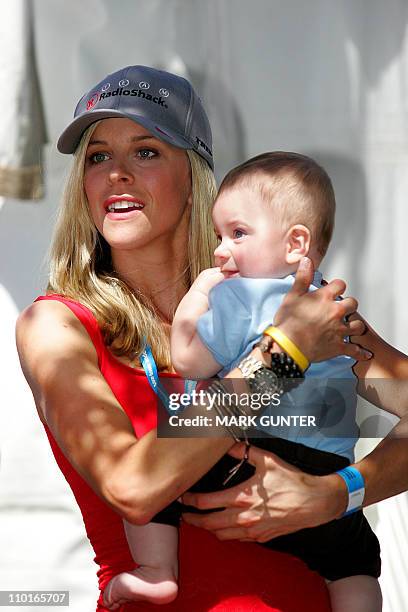 Lance Armstrongs parner Anna Hansen and their son Max watch the team presentation prior to the start of the Tour Down Under cycling race in Adelaide...