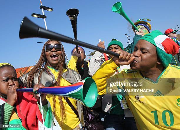 South African supporters sing and dance while waiting for the opening ceremony of the 2010 FIFA football World Cup on June 11, 2010 near Soccer City...