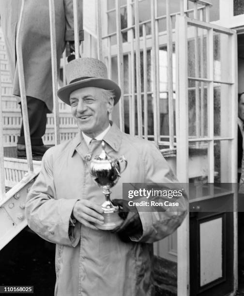 French businessman and racehorse owner Pierre Wertheimer with the trophy after his horse Lavandin, ridden by Rae Johnstone, won the Epsom Derby, 6th...