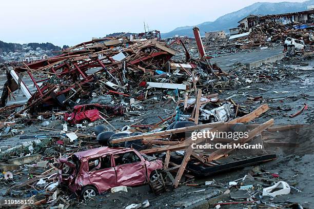 Destroyed vehicles lie near the rubble after the earthquake and tsunami devastated the area on March 16, 2011 in Minamisanriku, Japan. The 9.0...