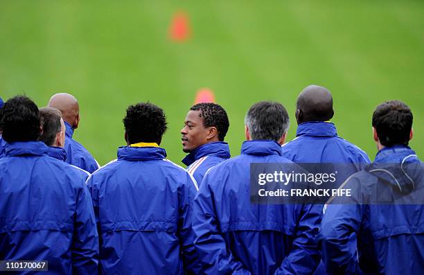 France's national football team captain Patrice Evra attend a training session with teammates at the Fields of Dreams stadium in Knysna on June 14,...