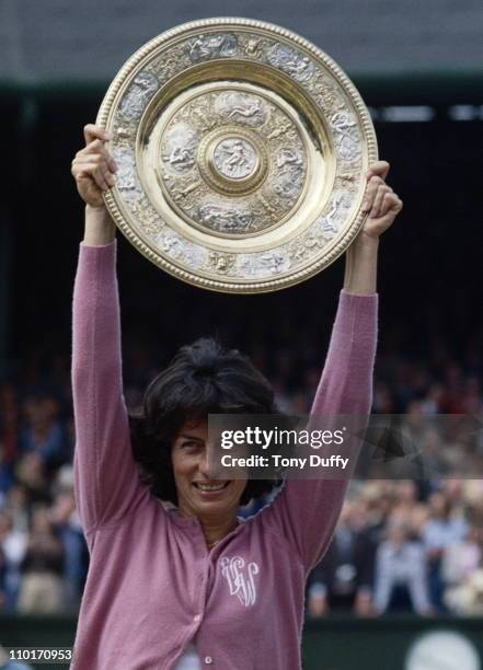 Virginia Wade of Great Britain holds aloft the Venus Rosewater Dish after defeating Betty Stove 4-6, 6-3, 6-1 in their Women's Singles Final match at...