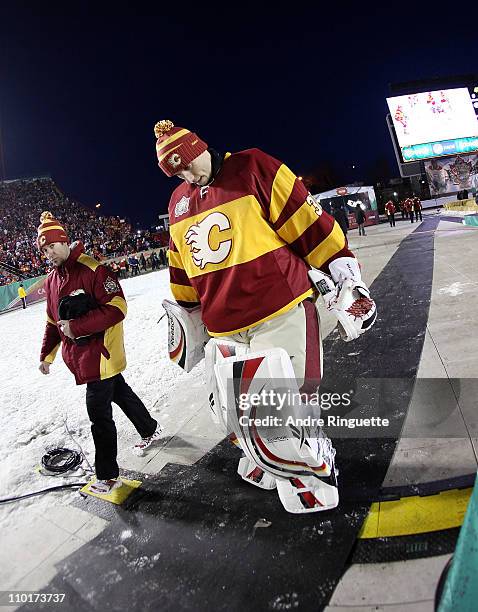 Henrik Karlsson of the Calgary Flames walks out for the 2011 NHL Heritage Classic Game at McMahon Stadium on February 20, 2011 in Calgary, Alberta,...