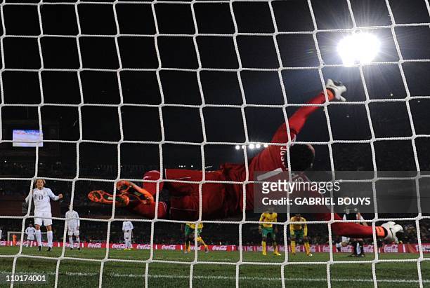 Uruguay's striker Diego Forlan scores a penalty past South Africa's goalkeeper Moeneeb Josephs during their Group A first round 2010 World Cup...