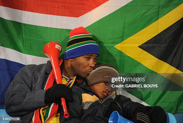 Supporters of South Africa react after their team lost to Uruguay in their 2010 World Cup group A first round football match on June 16, 2010 at...