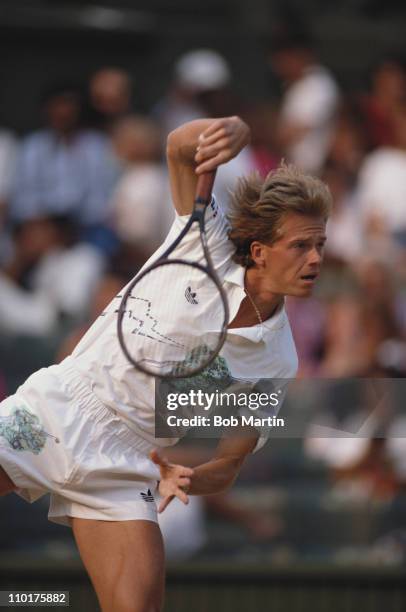 Stefan Edberg of Sweden stretches to make an overhead return during his Men's Singles final match against Boris Becker at the Wimbledon Lawn Tennis...