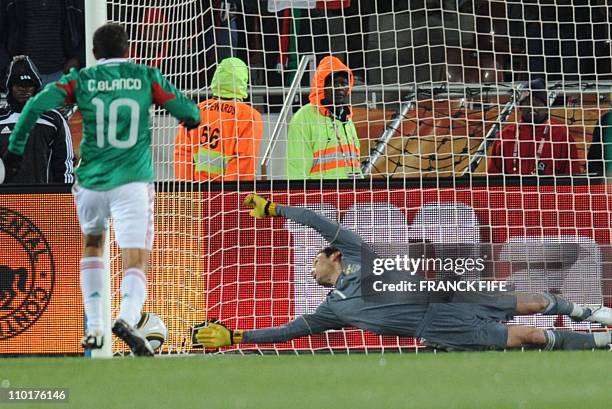 France's goalkeeper Hugo Lloris misses a penalty kick from Mexico's striker Cuauhtemoc Blanco during their Group A first round 2010 World Cup...