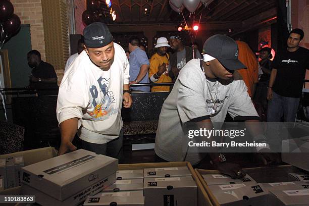 Sonny Saprano and Isaac "Picaso" White searches through the boxes and boxes of free Phat Farm shoes