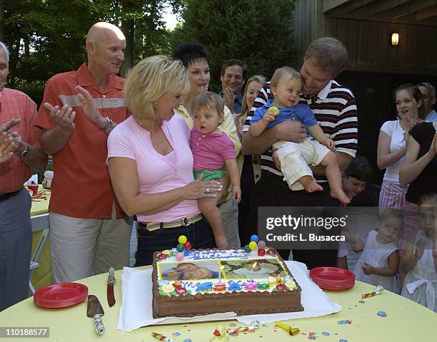 Joan Lunden and Jeff Konigsberg Hold the Twins Kate and Max Konigsberg with Pete Bolig and Deborah Bolig, the Twins Surrogate Mother, Looking on...