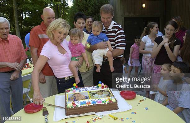 Joan Lunden and Jeff Konigsberg Hold the Twins Kate and Max Konigsberg with Pete Bolig and Deborah Bolig, the Twins Surrogate Mother, Looking on...