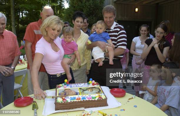 Joan Lunden and Jeff Konigsberg Hold the Twins Kate and Max Konigsberg with Pete Bolig and Deborah Bolig, the Twins Surrogate Mother, Looking on...