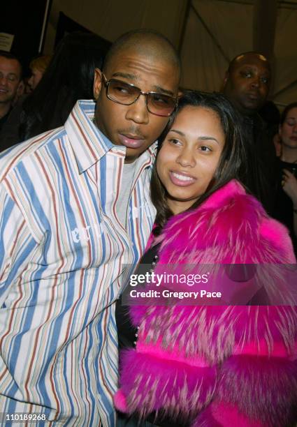 Ja Rule and wife Aisha Atkins during Olympus Fashion Week Fall 2004 - Luca Luca - Front Row and Backstage at The Tent at Bryant Park in New York...