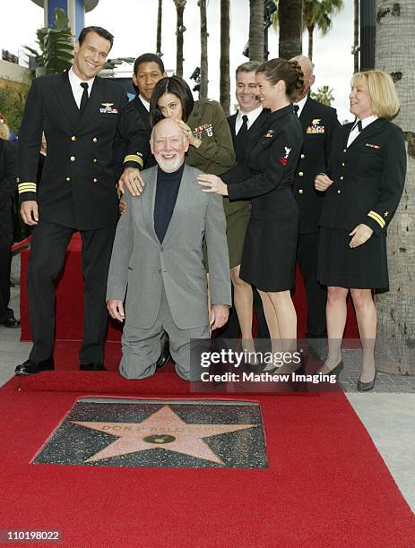 Donald P. Bellisario surrounded by cast of "JAG": David James Elliott, Scott Lawrence, Catherine Bell, Patrick Labyorteaux, Zoe McLellan and Karri...