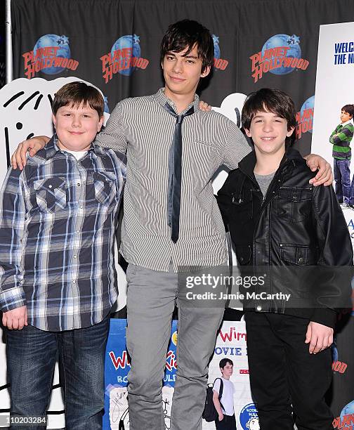 Actors Robert Capron,Devon Bostick and Zack Gordon visit Planet Hollywood Times Square on March 16, 2011 in New York City.