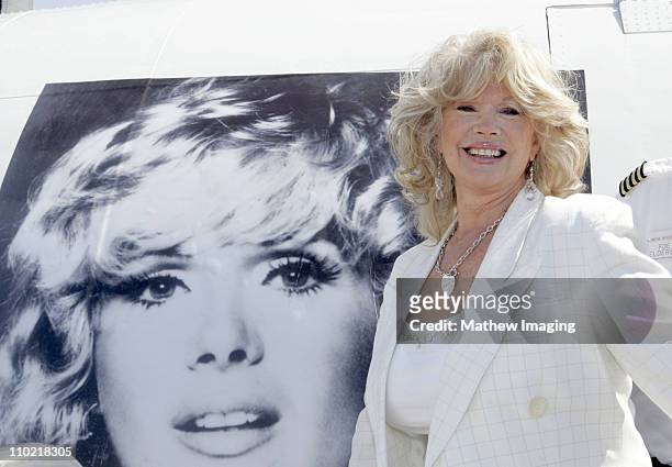 Connie Stevens poses with a Special Painted Lockheed Constellation picturing herself and nicknamed "The Connie"