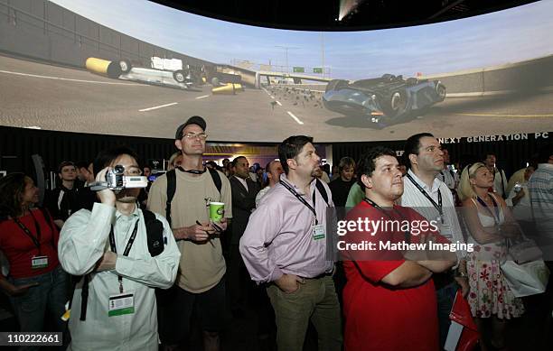 Attendees of the Electronic Entertainment Expo or E3 Expo, stopped by the EA Games booth to view some of the new games offered for the Microsoft XBox...