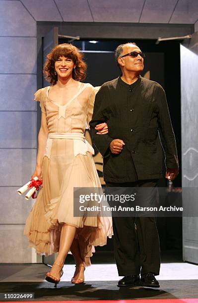 Milla Jovovich and Abbas Kiarostami during 2005 Cannes Film Festival - Cannes Awards Inside at Palais de Festival in Cannes, France.