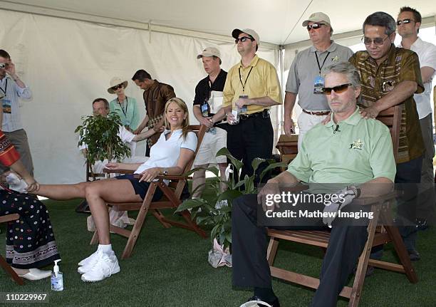 Nancy O'Dell and Michael Douglas get massages between holes, courtesy of the Thailand Tourism Board *EXCLUSIVE*