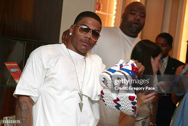 Nelly, as the auctioneer of the live auction with the Nike Air Force 1 sneakers contributed by the rap star himself