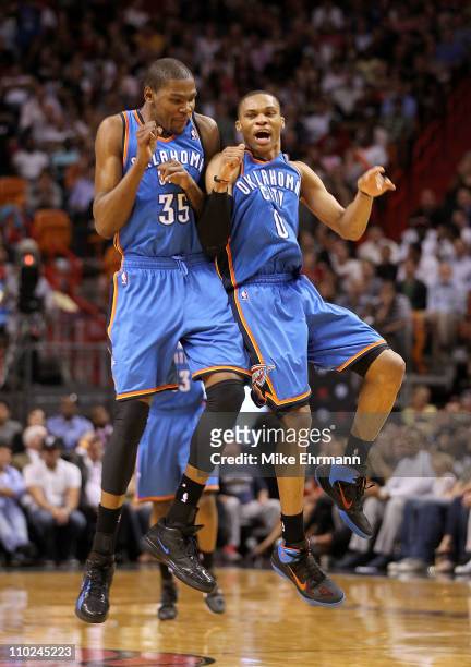 Kevin Durant and Russell Westbrook of the Oklahoma City Thunder celebrate after a 3 pointer during a game against the Miami Heat at American Airlines...