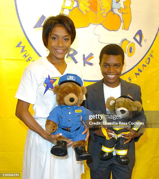 Dominique Dawes with a Build-A-Bear Worshop Bear and Marc John Jeffries with a Build-A-Bear Worshop Bear