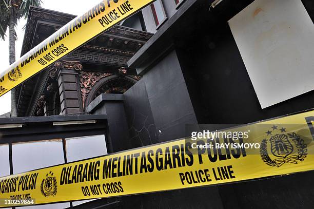 Police tape secures the residence of Indonesian rock musician Ahmad Dhani, who is known for his songs protesting against religious extremism, in...