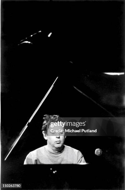 Philip Glass performs on stage, London, 1993.