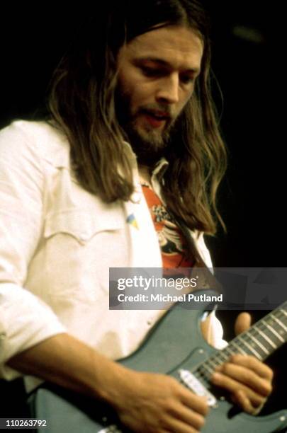 David Gilmour of Pink Floyd performs on stage at Hyde Park, London, 31st August 1974.