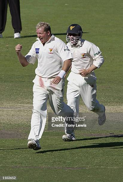 Tasmanian bowler David Saker celebrates as he takes his fifth wicket, Mark Harrity for 1, to claim outright victory in the Pura Cup mach beteween...