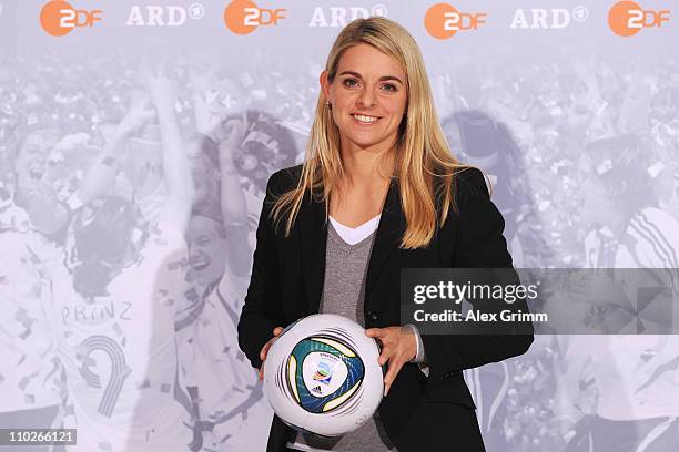 Nia Kuenzer poses during a photocall with the ARD and ZDF TV presenters for the FIFA Women World Cup 2011 at the Commerzbank Arena on March 17, 2011...