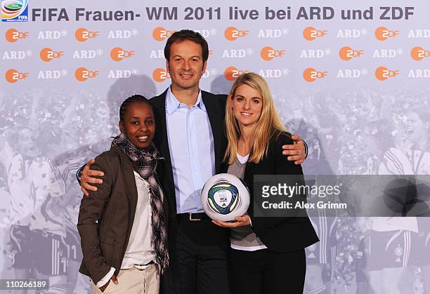 Shary Reeves, Claus Lufen and Nia Kuenzer pose during a photocall with the ARD and ZDF TV presenters for the FIFA Women World Cup 2011 at the...