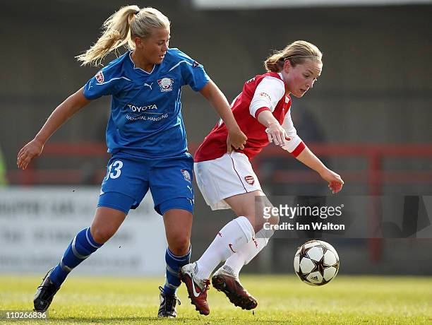Tilda Heimersson of Linkopings tries to tackle Kim Little of Arsenal during the UEFA Women's Champions League Quarter Final match between Arsenal and...