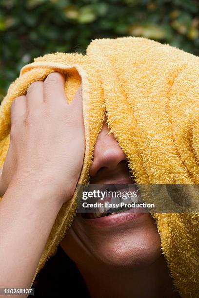 laughing woman drying her, headshot - airing stock pictures, royalty-free photos & images