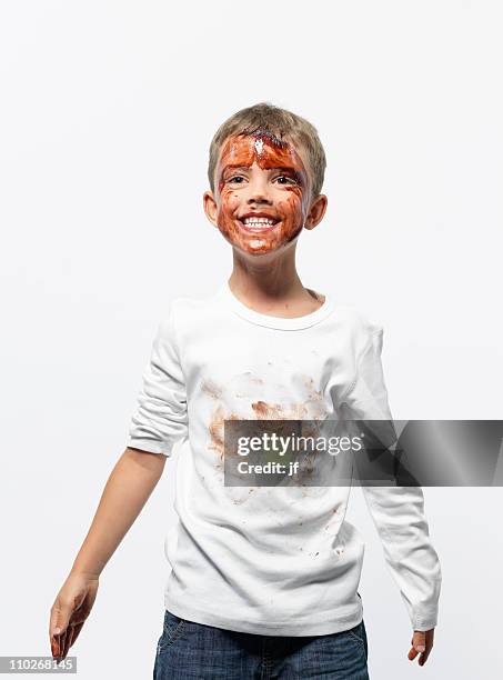 boy covered in chocolate sauce - dirty face stock-fotos und bilder