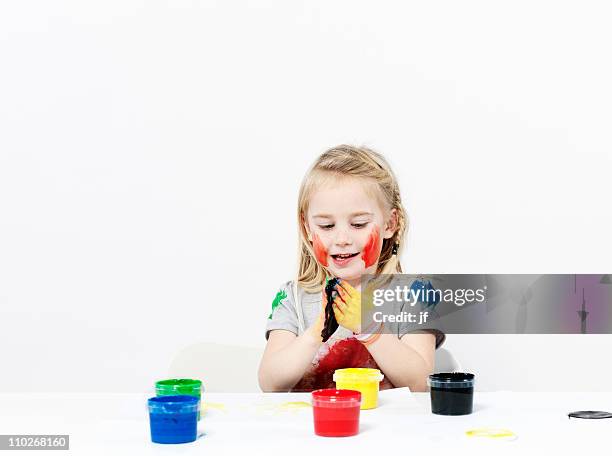 girl playing with finger paint - 4 girls finger painting bildbanksfoton och bilder