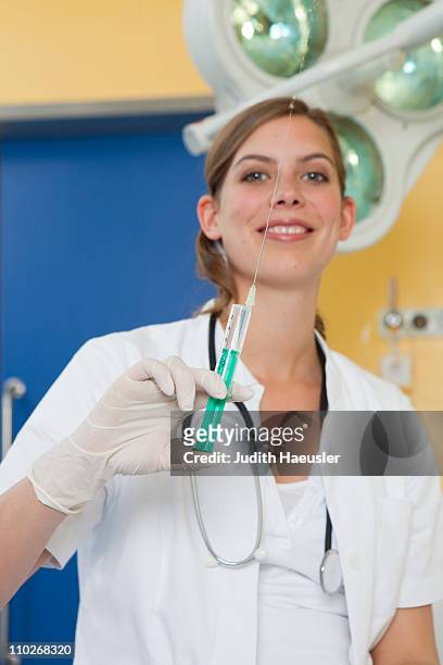 nurse preparing injection, happy - safe injecting stock pictures, royalty-free photos & images