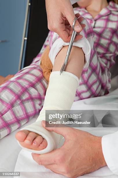 hands cut opening a plaster - broken trust stock pictures, royalty-free photos & images