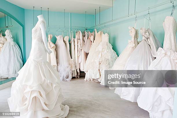 selection of wedding dresses in boutique - wedding dress fotografías e imágenes de stock