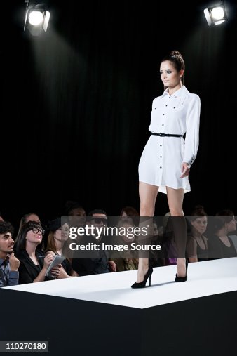 Model on catwalk at fashion show Model on catwalk at fashion show