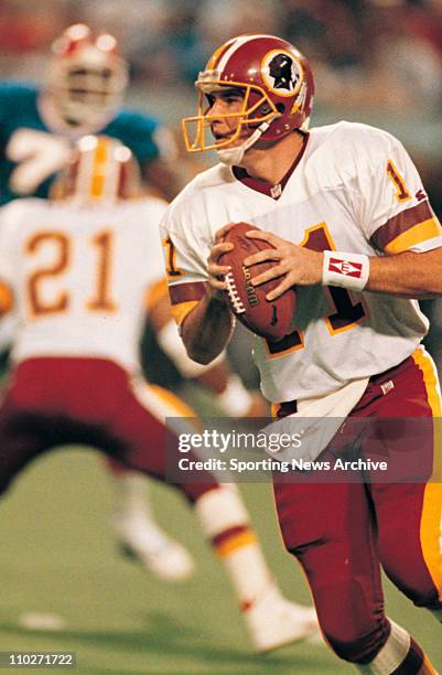 Jan 26, 1992 - Minneapolis, Minnesota, USA - Washington Redskins MARK RYPIEN, scramble against Buffalo Bills in Super Bowl 26 at Metrodome.