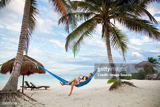 couple in hammock on vacation - méxico stock pictures, royalty-free photos & images