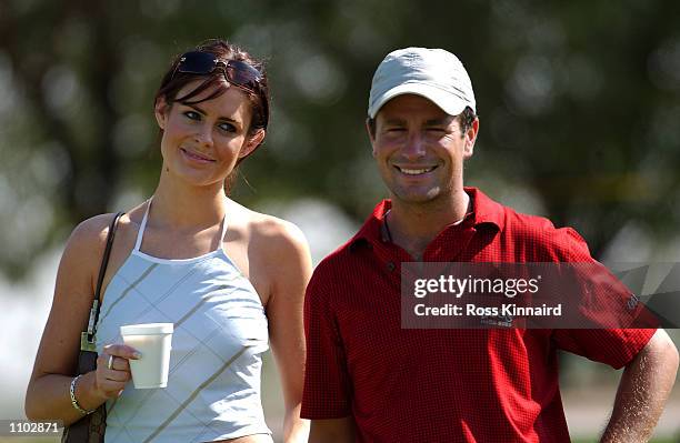 Susie Amy, ''Chardonny'' form the TV series Footballers Wives with boyfriend and golfer Steve Webster of England on the 3rd hole during his practice...