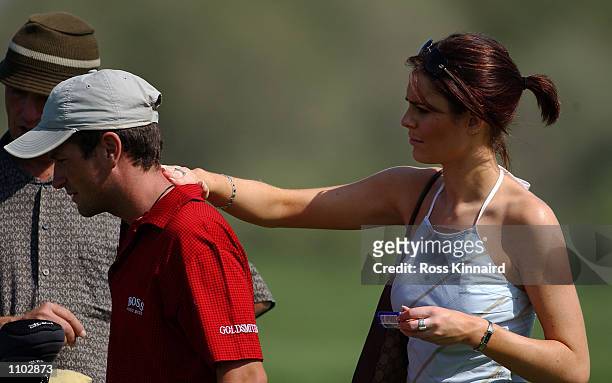 Susie Amy, ''Chardonny'' form the TV series Footballers Wives puts sun cream on the back of boyfriend and golfer Steve Webster of England on the 3rd...